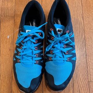 Nike Black and Blue Athletic Trainers with Coral Accents